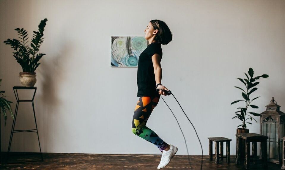 girl doing an exercise with a skipping rope